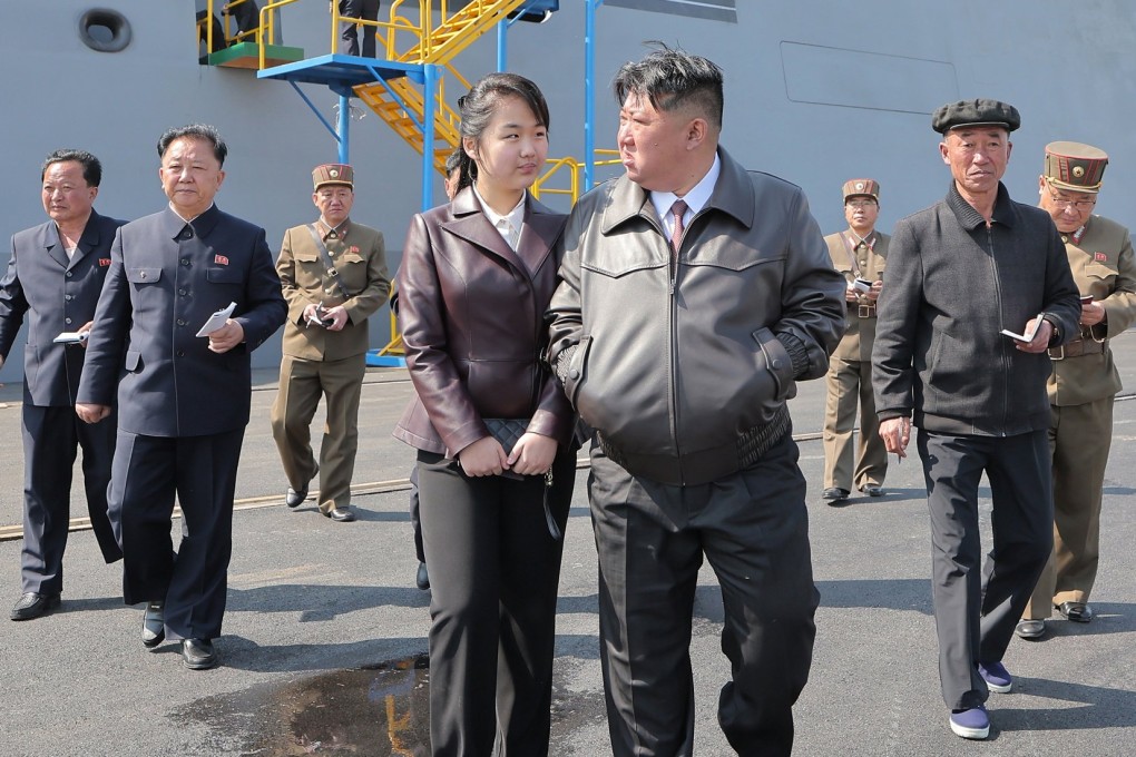 North Korean leader Kim Jong-un and daughter Kim Ju-ae attending the first test firing on the destroyer Choe Hyon at an undisclosed location in North Korea in April. Photo:  EPA-EFE