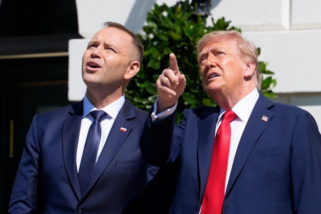US President Donald Trump (right) and Polish President Karol Nawrocki watch a fly-over of US military aircraft at the White House on Wednesday. Photo: EPA