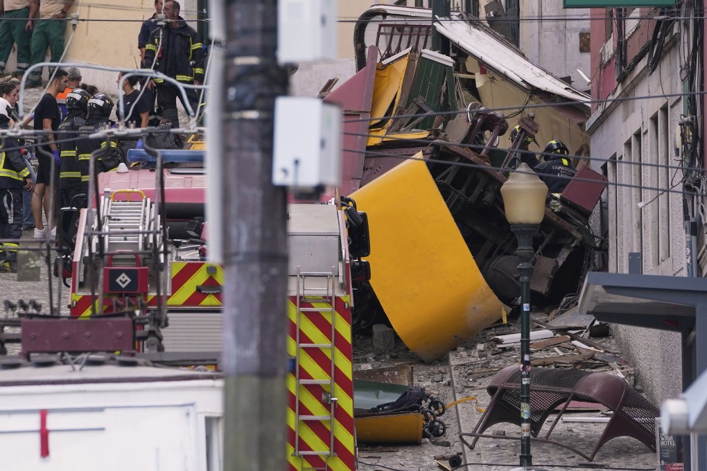 Emergency teams work at the site of a derailed electric streetcar in Lisbon, Portugal, on Wednesday. Photo: AP