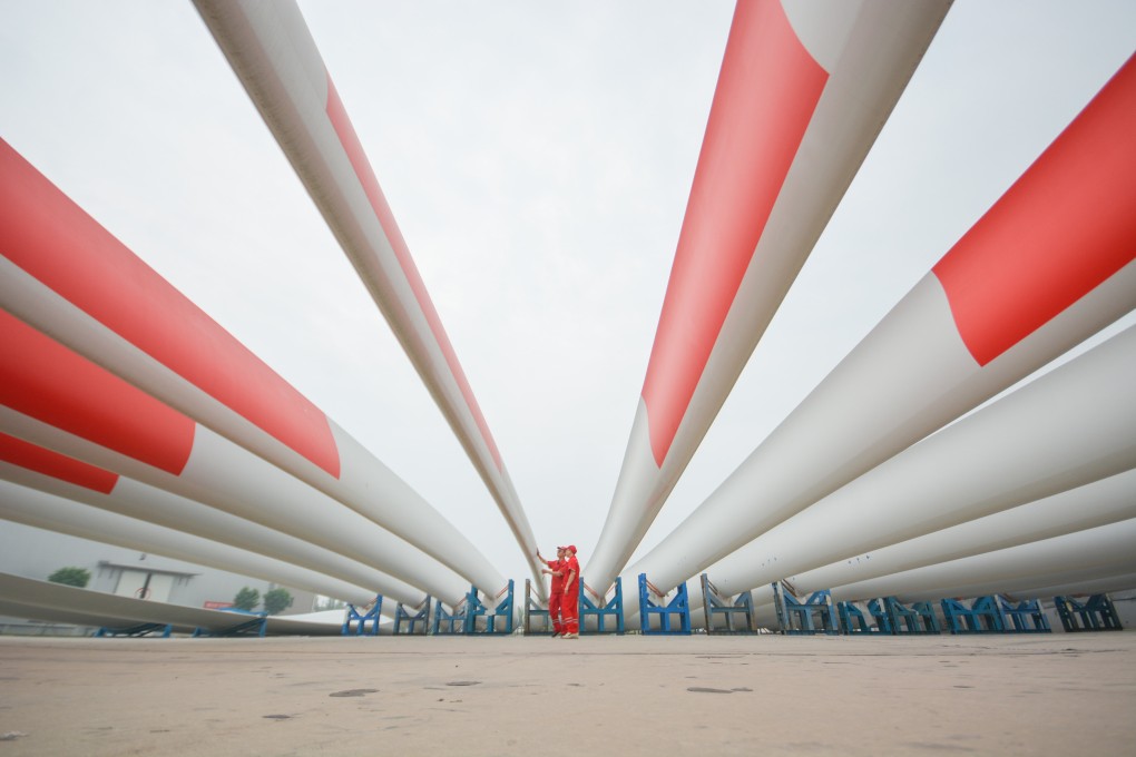 New wind turbine blades sit at a factory on July 15, 2022 in Handan, in China’s northern province of Hebei. Photo: VCG via Getty Images