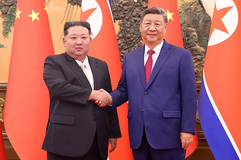 Chinese President Xi Jinping (right) and North Korean leader Kim Jong-un meet for talks at the Great Hall of the People in Beijing on Thursday. Photo: China Daily via Reuters