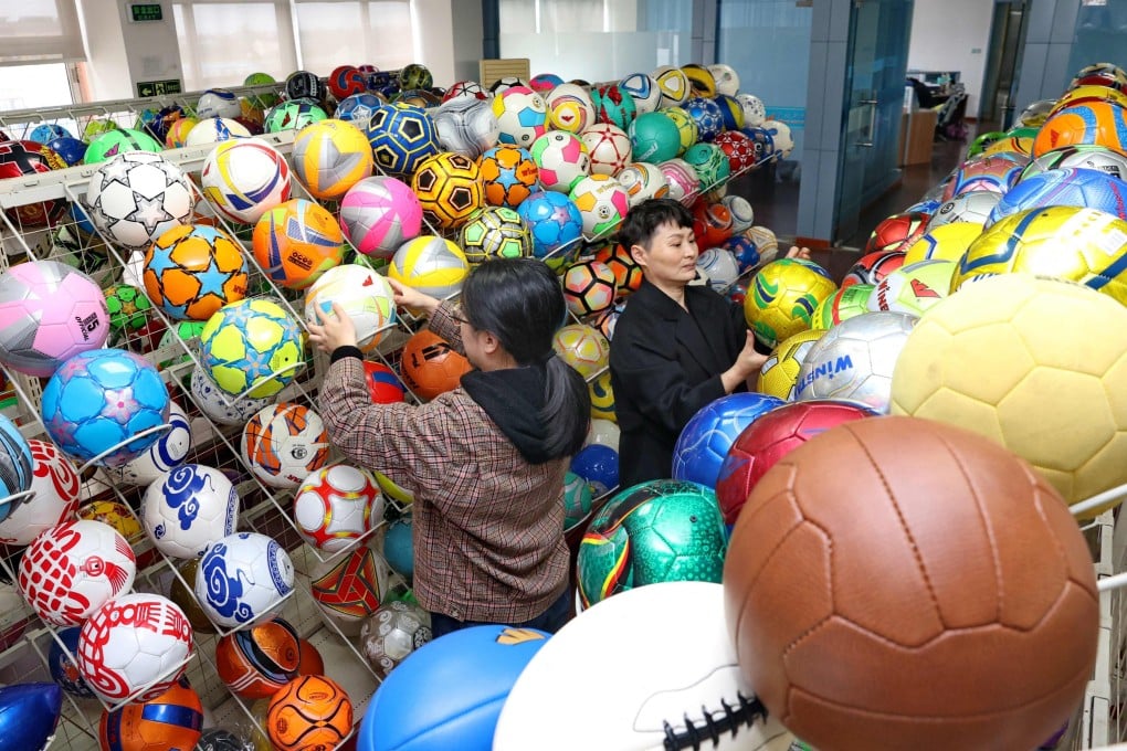 Workers check footballs at a factory in Nantong, Jiangsu province, in 2022. Photo: AFP