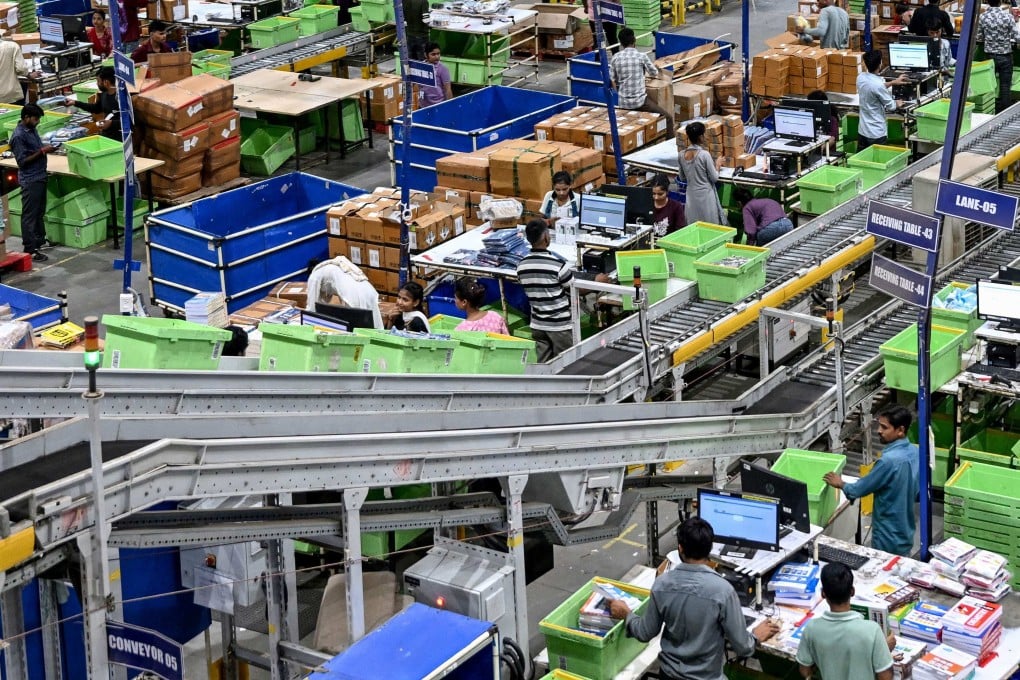 Workers process packages for dispatch at an e-commerce fulfillment centre in Haryana, India, last month. Photo: AFP