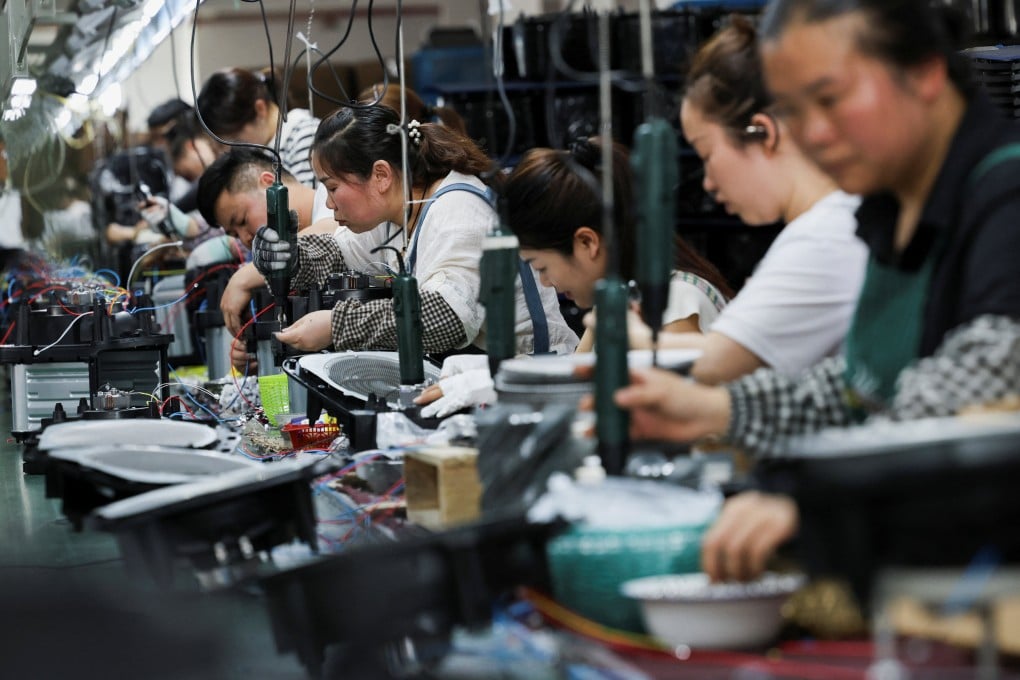 Workers assemble electronic appliances on a production line at a factory run by the Chinese company Gstar in the eastern Zhejiang province. China aims to shore up its supply chain for key electronic and telecommunications equipment, as the country confronts rising US export controls on chip technology. Photo: Reuters