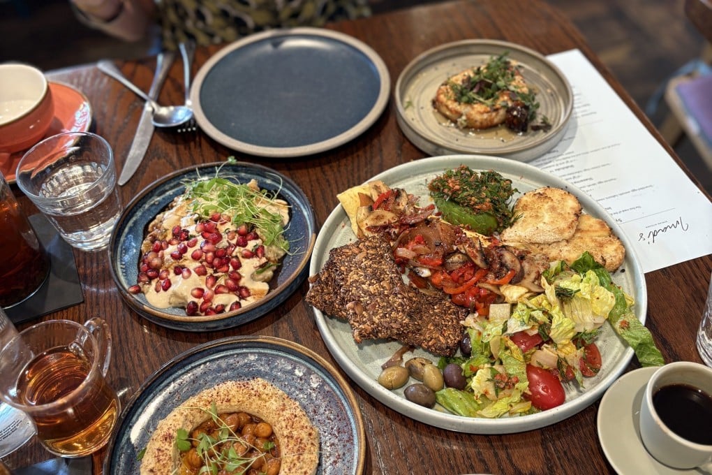 A hearty Syrian breakfast at Imad’s Syrian Kitchen in Carnaby Street, London, featuring fresh dips and mezze. Photo: Charmaine Mok