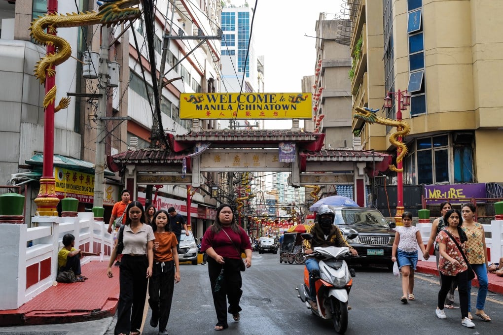 People walk through Binondo in April. Photo: Jeoffrey Maitem