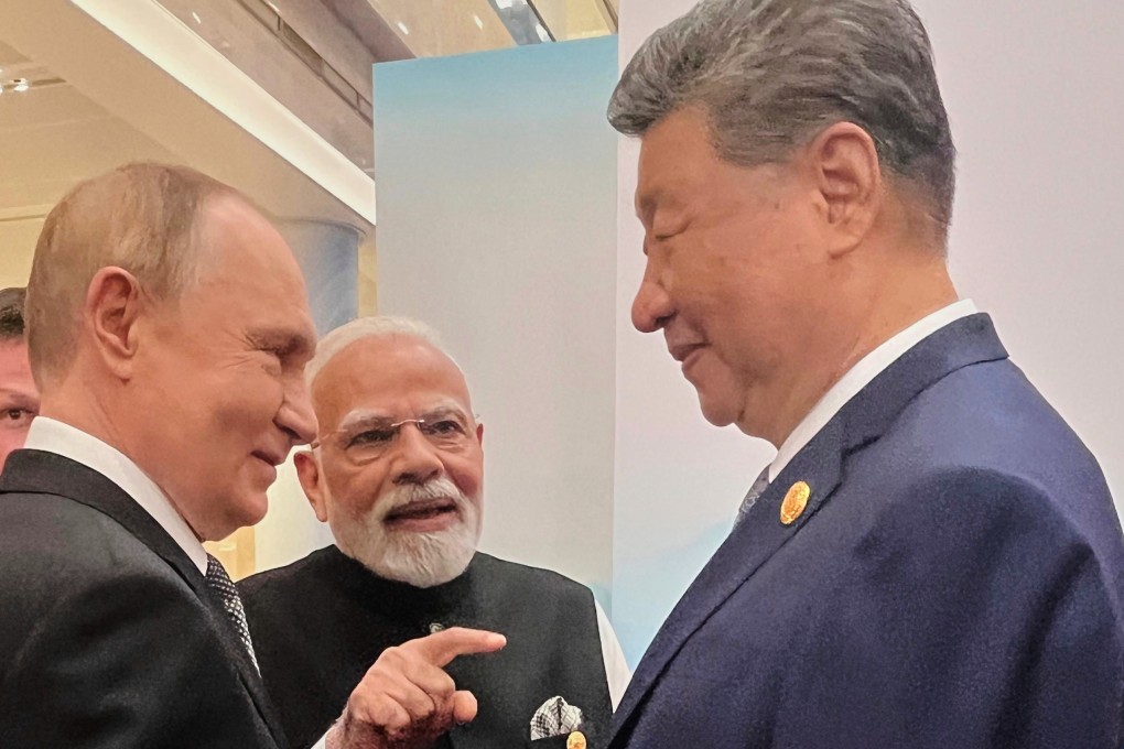 From the left, Russian President Vladimir Putin, Indian Prime Minister Narendra Modi and Chinese President Xi Jinping talk ahead of the Shanghai Cooperation Organisation summit in the Meijiang Convention and Exhibition Centre in Tianjin on September 1. Photo: AP
