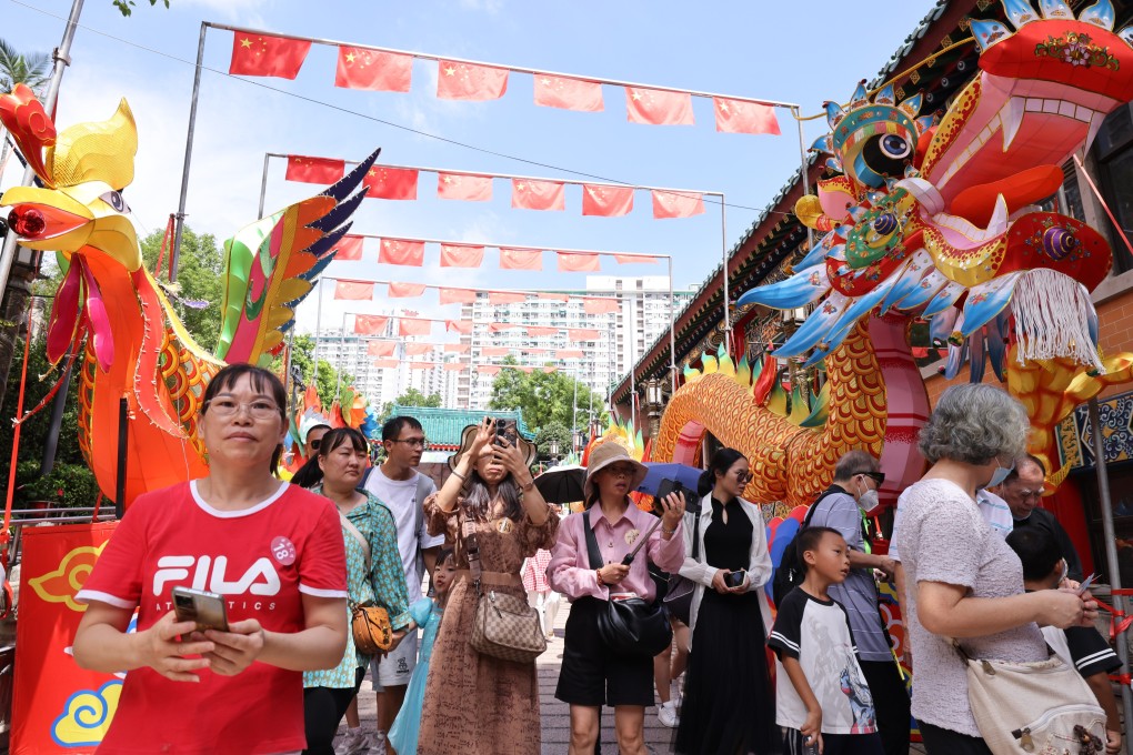 Tourists visit Sik Sik Yuen Wong Tai Sin Temple. Photo. Nora Tam