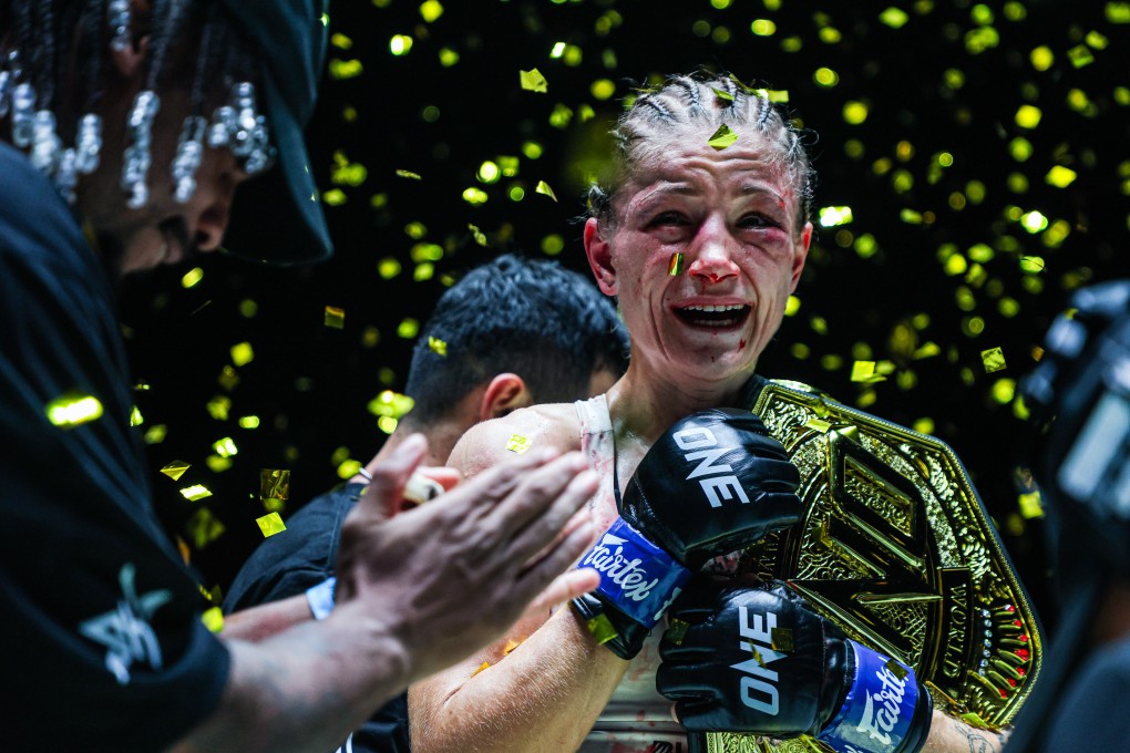 An emotional Stella Hemetsberger shows off her Strawweight Muay Thai world title belt. Photo: ONE Championship