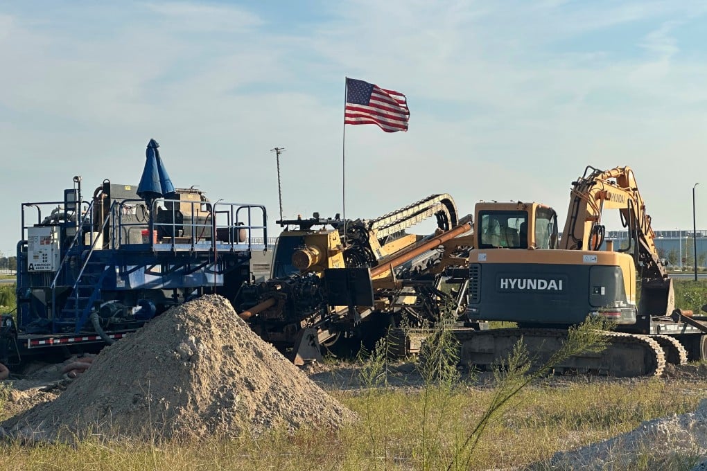 An American flag flies above a piece of heavy machinery at the site of Hyundai Motor Group’s electric vehicle plant in Ellabell, Georgia, on Friday. Photo: AP