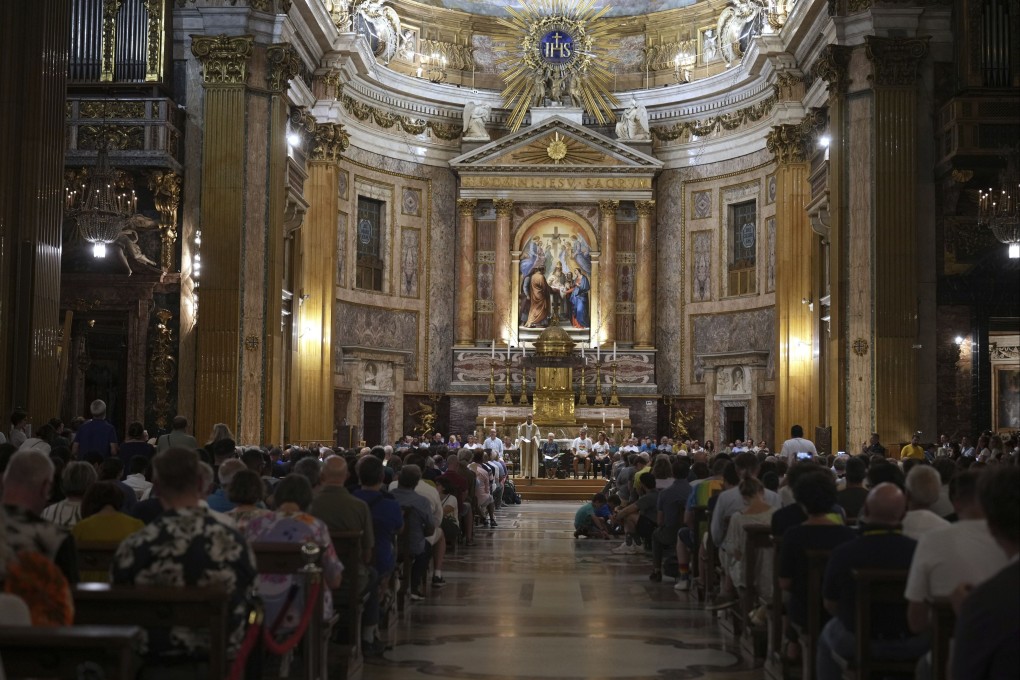 Members of the LGBTQ community attend a vigil prayer in the Church of the Gesu in central Rome on Friday. Photo: AP