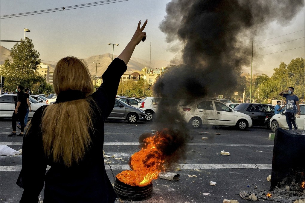 Iranians protests the death of 22-year-old Mahsa Amini in Tehran in October 2022. Photo: AP