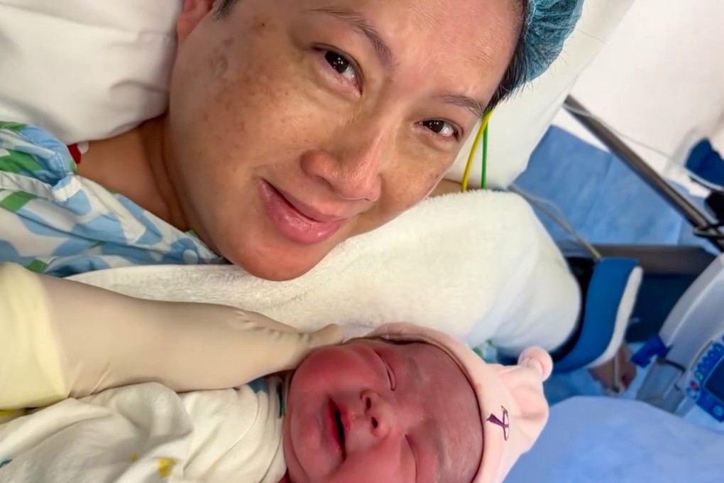 58-year-old Hongkonger Chan Lai-lai with her newborn daughter in the delivery room on Saturday. Photo: Handout