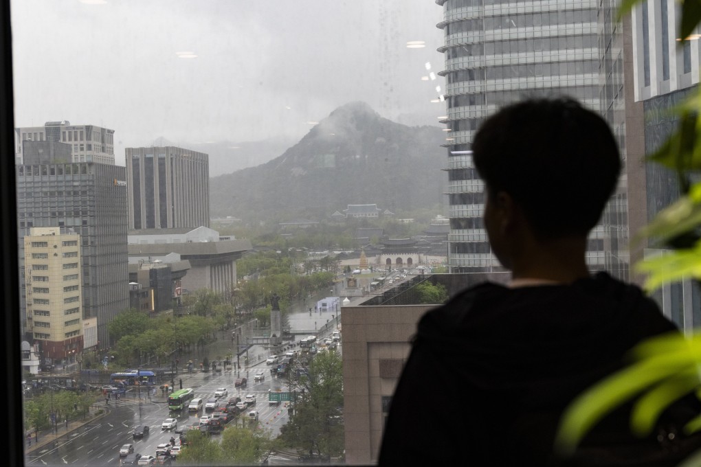 A North Korean defector looks from a balcony in Seoul, South Korea. Photo: EPA-EFE
