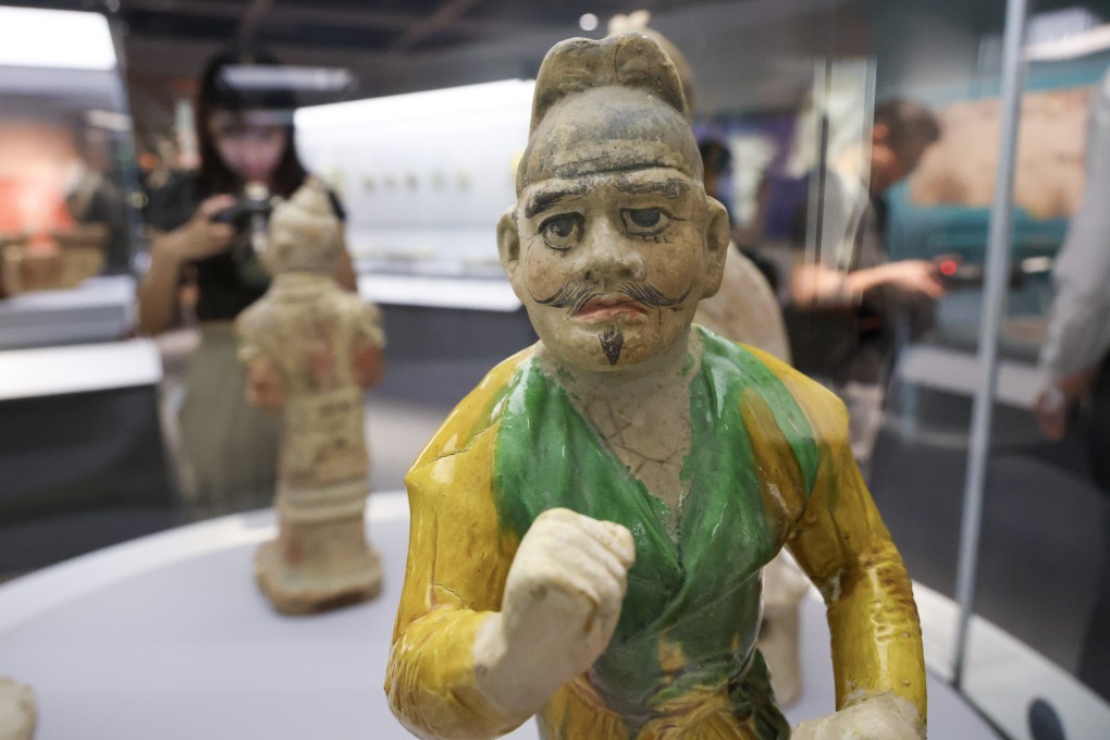 Painted figurines that have kept their colours are among the highlights of the exhibition. Photo: Dickson Lee