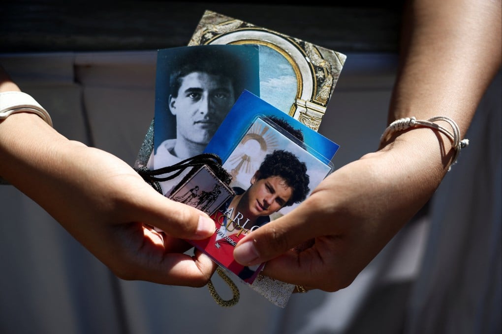 A person holds a picture depicting Carlo Acutis, the first millennial to be made a Catholic saint. Photo: Reuters