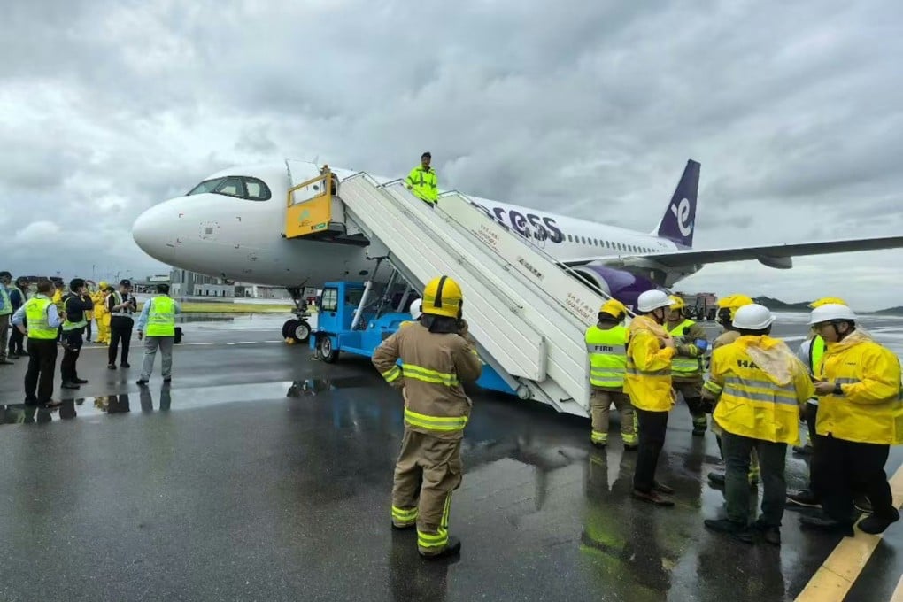 Flight UO235 landed at Hong Kong airport on Monday, with smoke seen coming from the landing gear. Photo: Handout