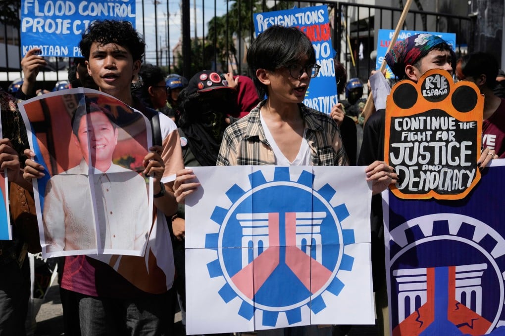 Protesters hold placards, including a picture of Philippine President Ferdinand Marcos Jnr, during a rally to condemn corruption in flood control projects outside the Department of Public Works and Highways in Manila on Thursday. Photo: AP