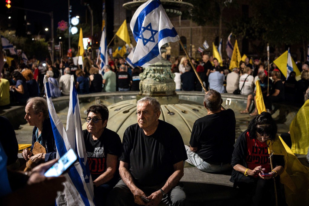 People attend a demonstration organised by the families of Israeli hostages taken captive in Gaza, calling for action to secure their release and a ceasefire in the war against Hamas, in Jerusalem, Israel on Sunday. Photo: AFP