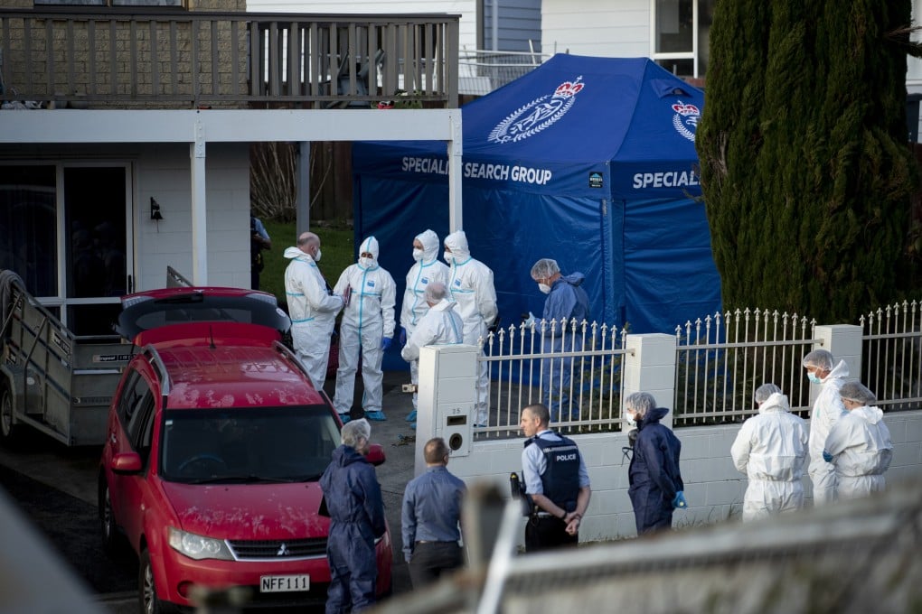 New Zealand police and forensics teams at the property where the children’s remains were discovered inside suitcases in 2022. Photo: NZME