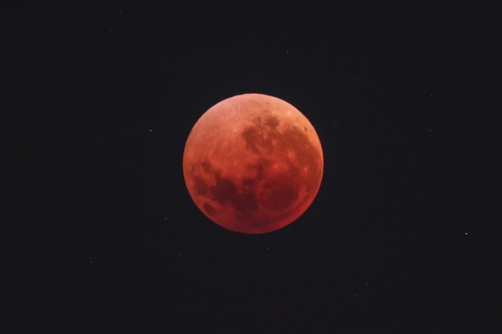 The “Blood Moon” is pictured during an eclipse in the night sky over Sydney, Australia on Sunday. Photo: AFP