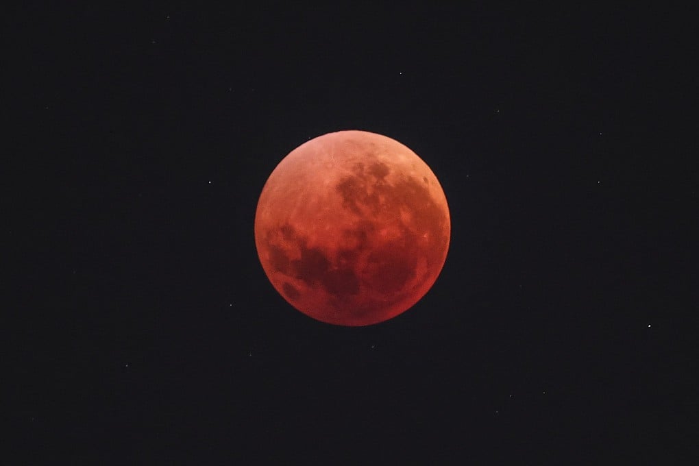 The “Blood Moon” is pictured during an eclipse in the night sky over Sydney, Australia on Sunday. Photo: AFP