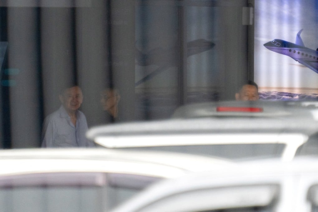 Thailand’s former prime minister Thaksin Shinawatra leaves after exiting a private jet terminal at Bangkok’s Don Mueang International Airport on Monday. Photo: Reuters
