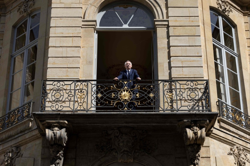 France’s Prime Minister Francois Bayrou poses from the balcony of his office in Paris. Photo: AFP