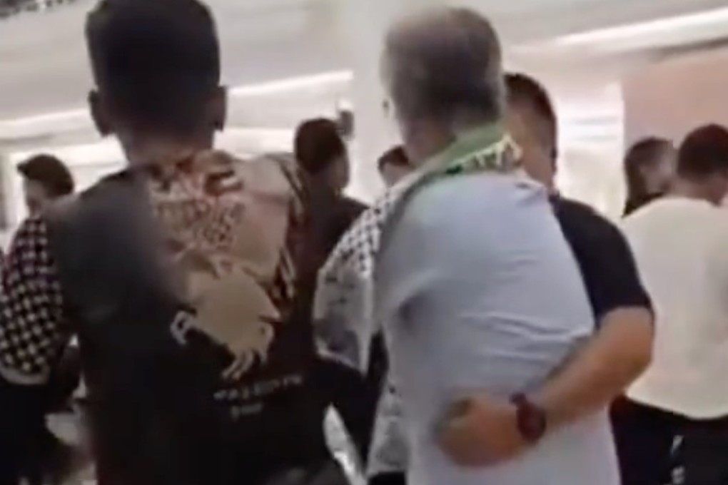 A screengrab from a social media video shows a Sinar KLCC  security guard grappling with former MP Chua Tian Chang (centre). Photo: Handout
