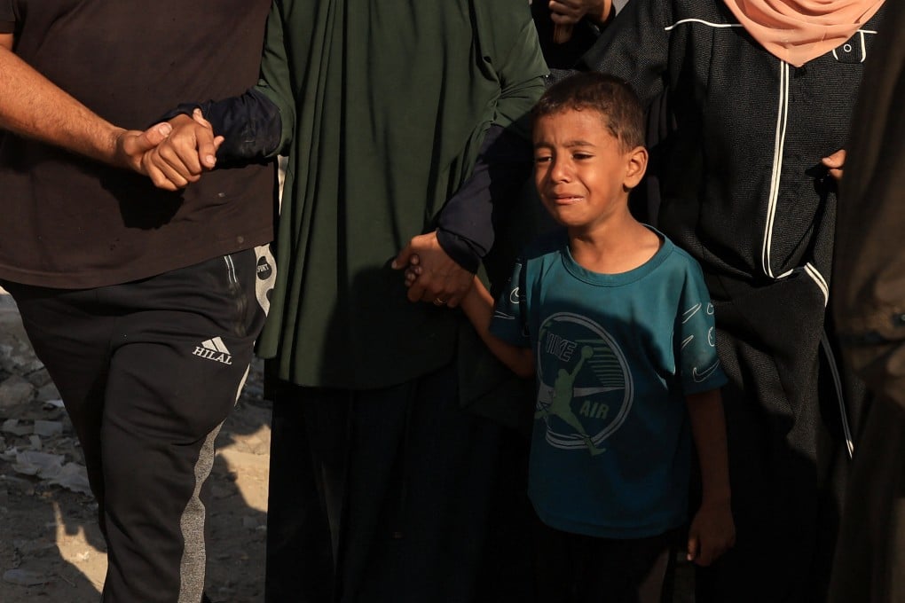 A boy cries during the funeral of Palestinians killed in overnight Israeli strikes, according to doctors, at Al-Shifa Hospital in Gaza City, on Monday. Photo: Reuters