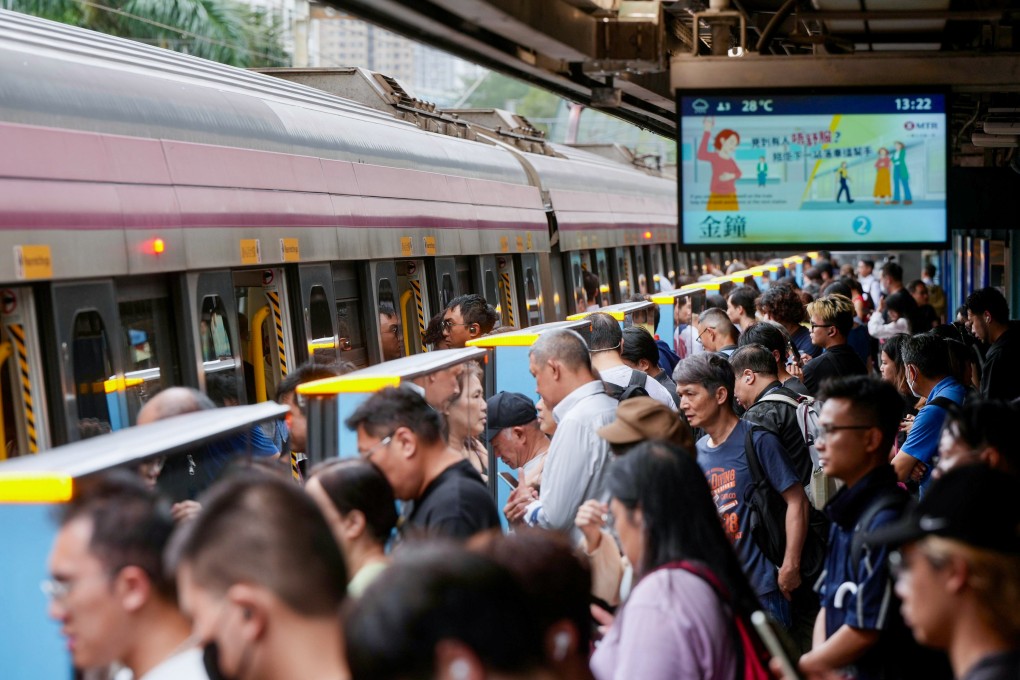 Residents board an MTR train at Tai Wai station after the typhoon signal was lowered. Photo: Sam Tsang
