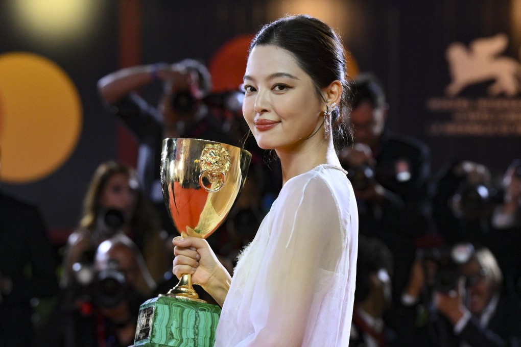Chinese actress Xin Zhilei holds the Volpi Cup for best actress for her performance in The Sun Rises on Us All at the 82nd Venice International Film Festival, on September 6, 2025. She discusses her acting journey, her historic win and more. Photo: EPA
