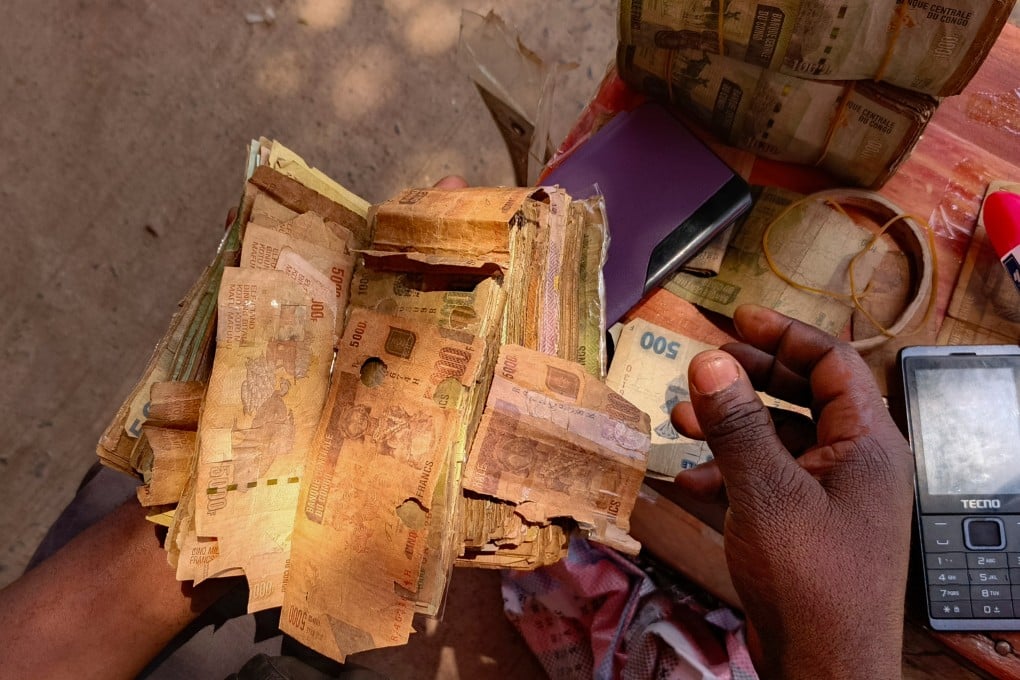Perforated notes are seen in Bukavu, Democratic Republic of Congo, on August 29. Photo: AP