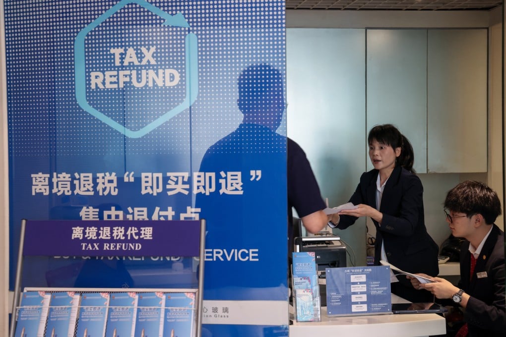 Staff members offer tax refund service for a tourist at a MixC shopping mall in Shenzhen, south China’s Guangdong Province, on April 30. Photo: Xinhua