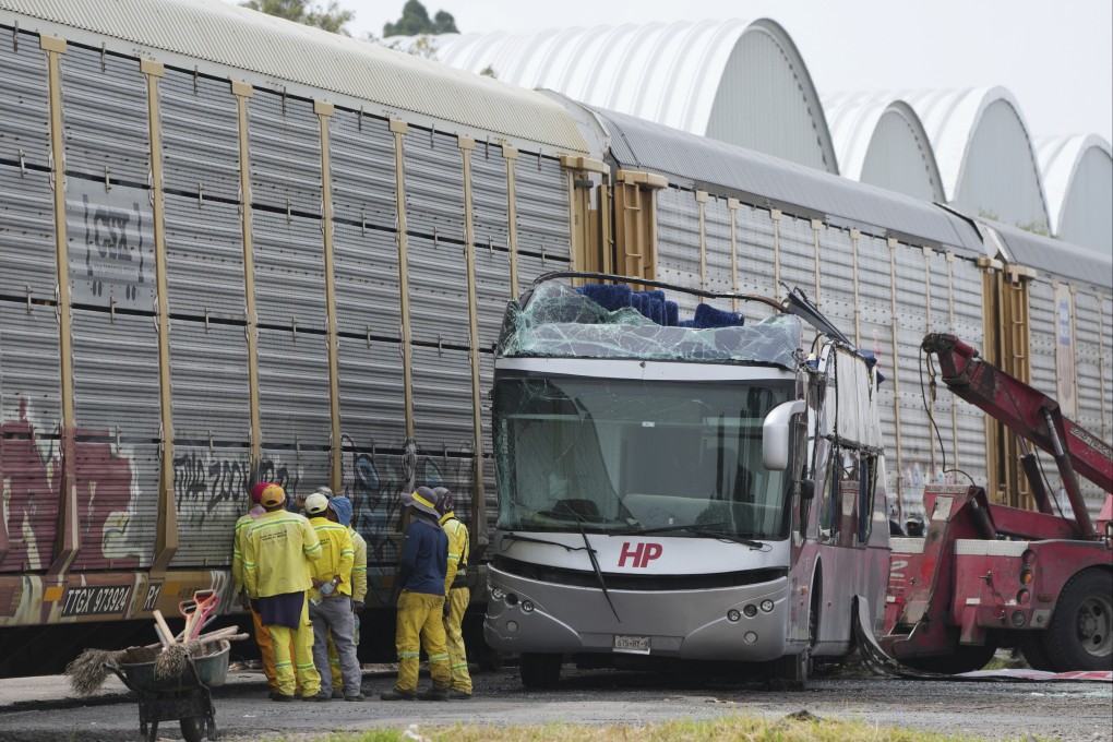 The scene of the accident, where a freight train crashed into a double-deck bus. Photo: AP