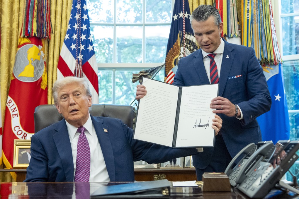 US President Donald Trump hands a signed executive order to Defense Secretary Pete Hegseth renaming the Department of Defence as the Department of War in the Oval Office of the White House on September 5, 2025. An arm of the government dedicated to war also existed in imperial China. Photo: AP