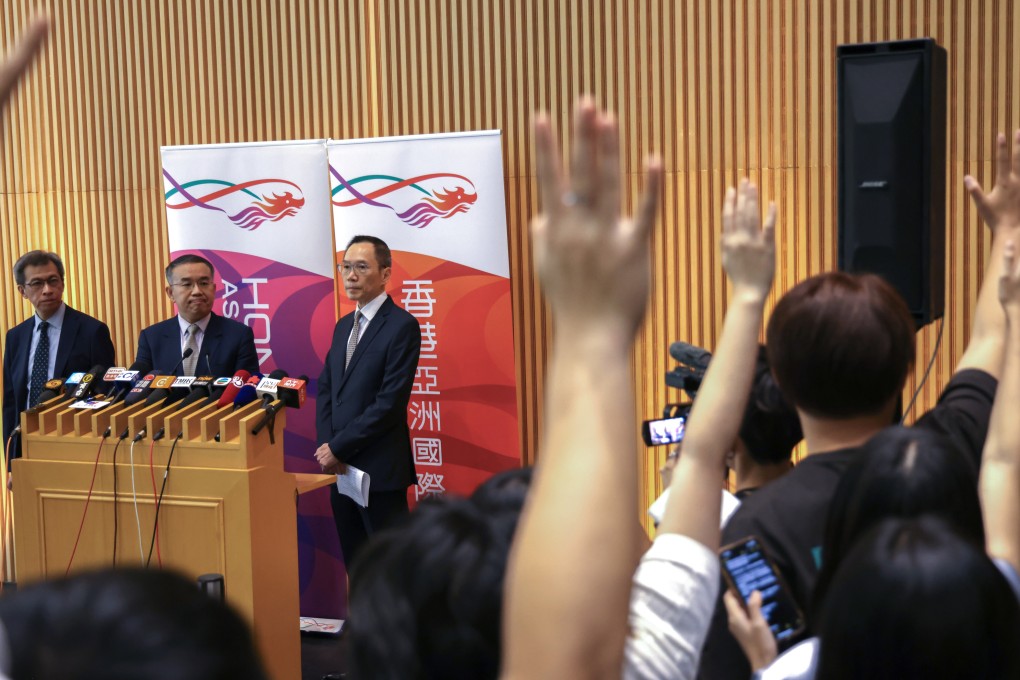 From the left, Permanent Secretary for Financial Services and the Treasury Andrew Lai Chi-wah, Secretary for Financial Services and the Treasury Christopher Hui Ching-yu, and Director of Government Logistics Carlson Chan Ka-shun attend a press briefing on the government procurement regime after the drinking water scandal, at the government headquarters in Hong Kong on August 21. Photo: Karma Lo