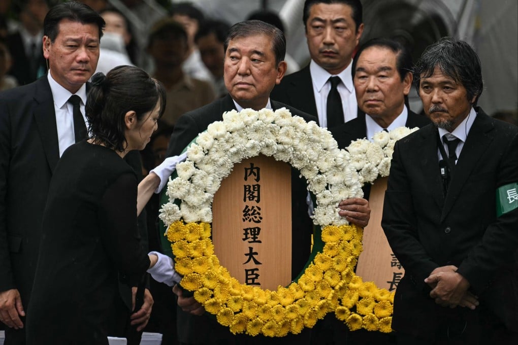 Japan’s Prime Minister Shigeru Ishiba lays a wreath during the annual memorial ceremony for victims of the WWII atomic bombing of Nagasaki last month. Photo: AFP