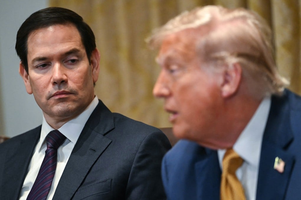 US Secretary of State Marco Rubio, left, looks on as US President Donald Trump speaks during a cabinet meeting at the White House in July. Photo: AFP