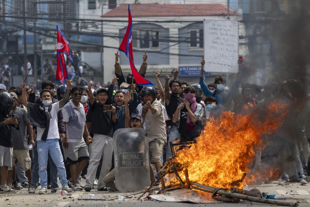 Protesters clash with police in front of the parliament building in Kathmandu on September 8. Photo: EPA