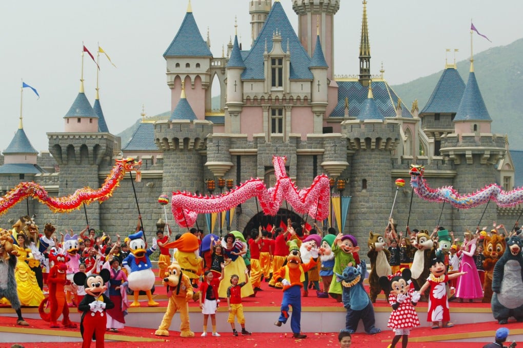 Mickey and Minnie Mouse perform on stage with other characters in front of the castle of Sleeping Beauty at the official opening of Hong Kong Disneyland on September 12, 2005. Photo: SCMP Archives