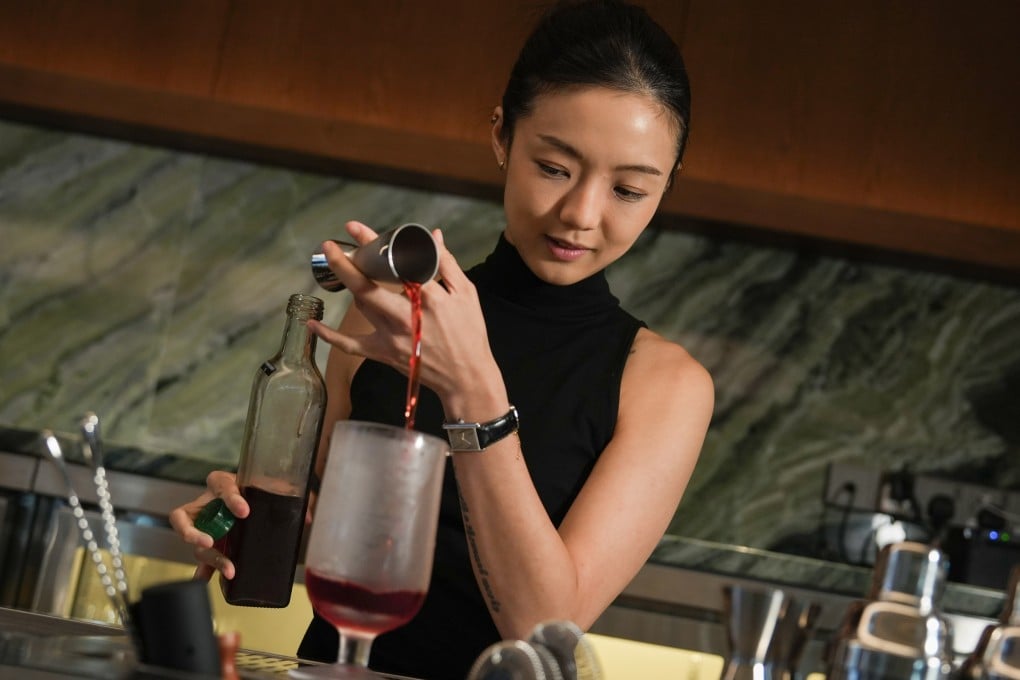 Award-winning bartender Shelley Tai pours a drink at her new bar, Mius, on Gough Street in Central, Hong Kong. Photo: Sun Yeung