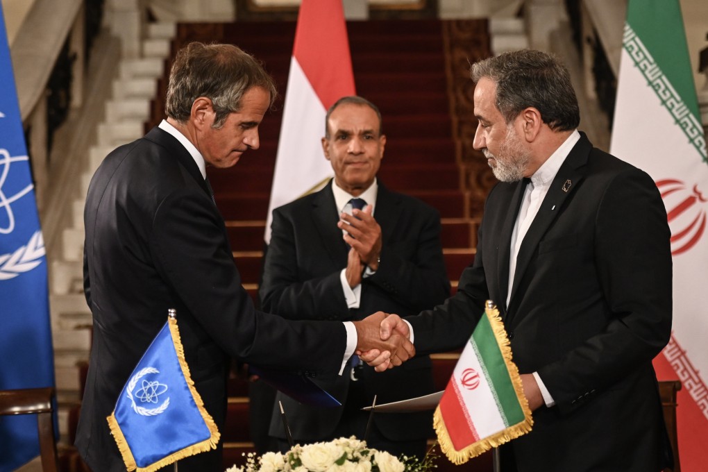 IAEA chief Rafael Grossi (left) and Iranian Foreign Minister Abbas Araghchi shake hands after signing an agreement in presence of Egyptian Foreign Minister Badr Abdelatty (centre) at Tahrir Palace in Cairo on Tuesday. Photo: dpa