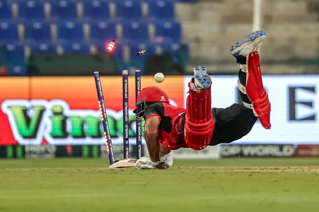 Hong Kong’s Kalhan Challu is run out by Afghanistan’s Azmatullah Omarzai during the Asia Cup game at the Sheikh Zayed Cricket Stadium. Photo: AFP