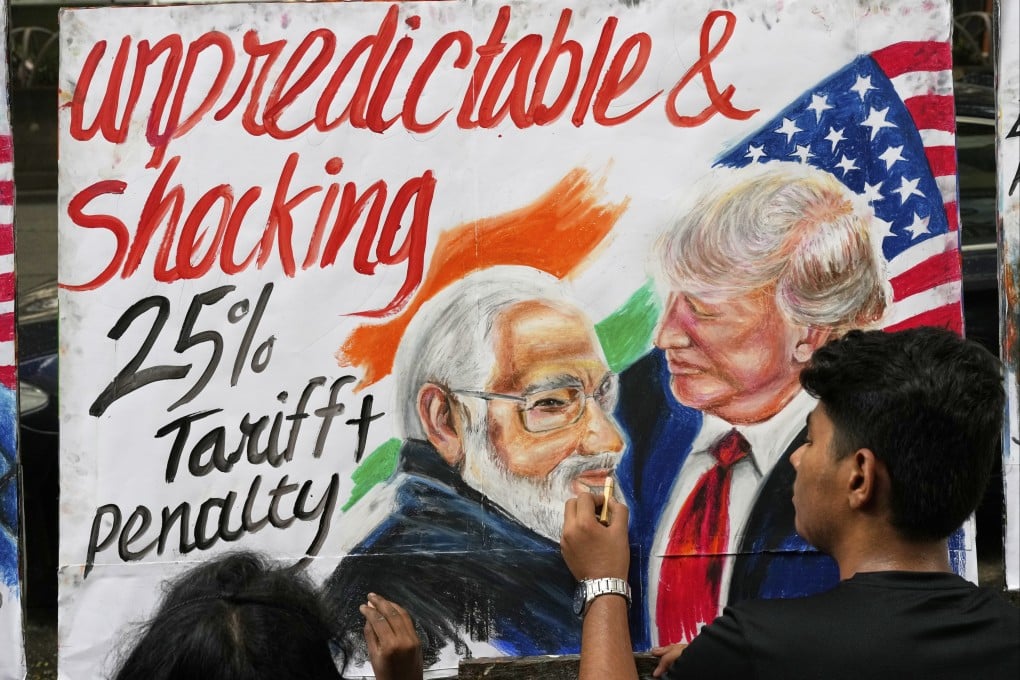 A student completes artwork depicting US President Donald Trump and Indian Prime Minister Narendra Modi in Mumbai, India, in August. Photo: AP