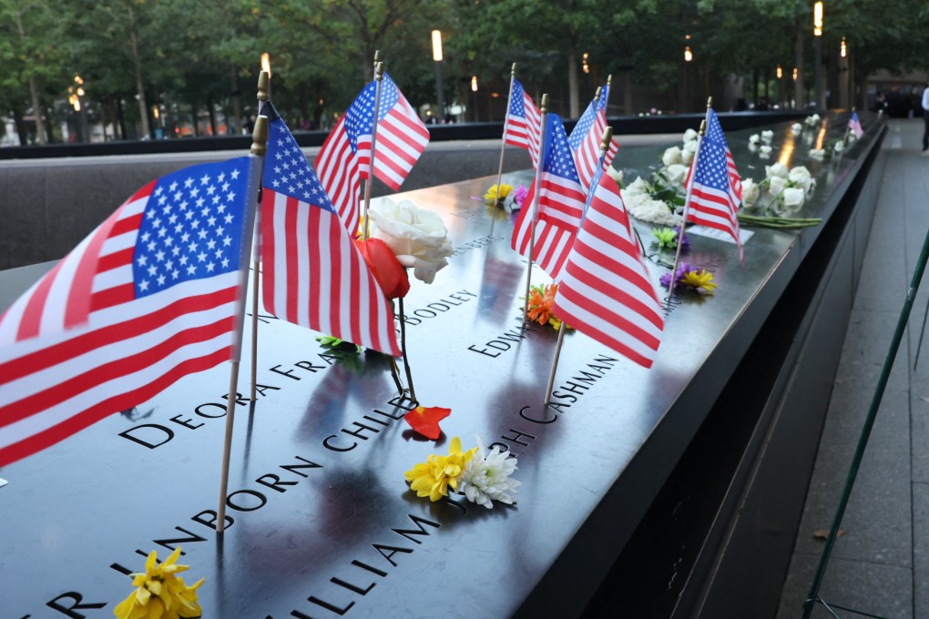 Flags placed in the wall in the South Tower Pool at the National September 11 Memorial that is part of the World Trade Centre complex in New York Thursday. Photo: AFP