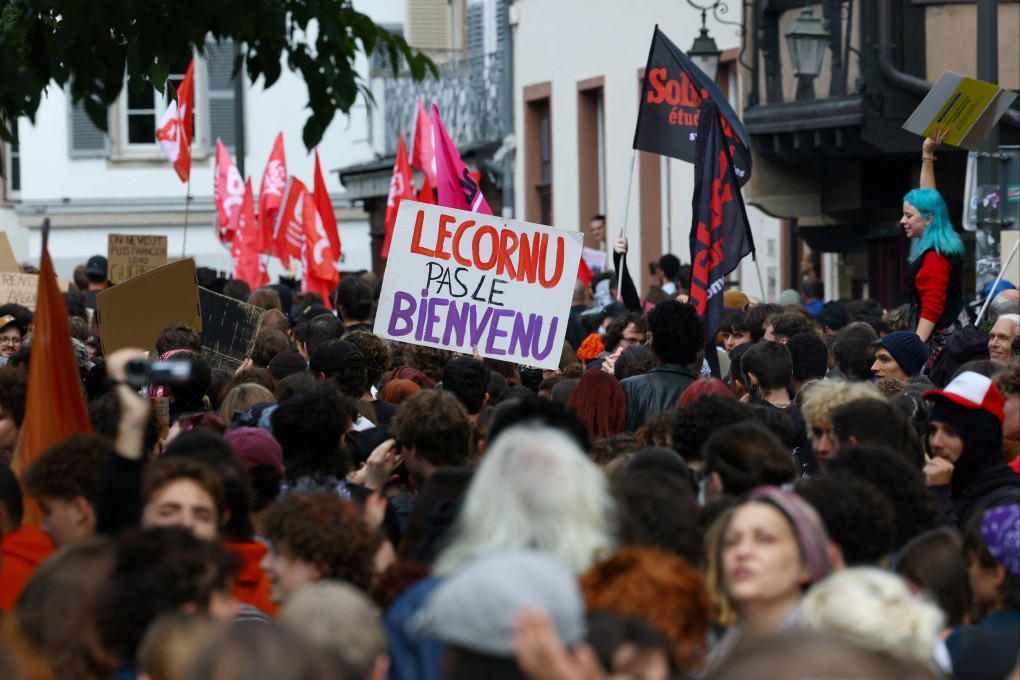 A French protester holds a placard reading “Lecornu, not welcome” during a “block everything” demonstration in Strasbourg on Wednesday. Photo: Reuters