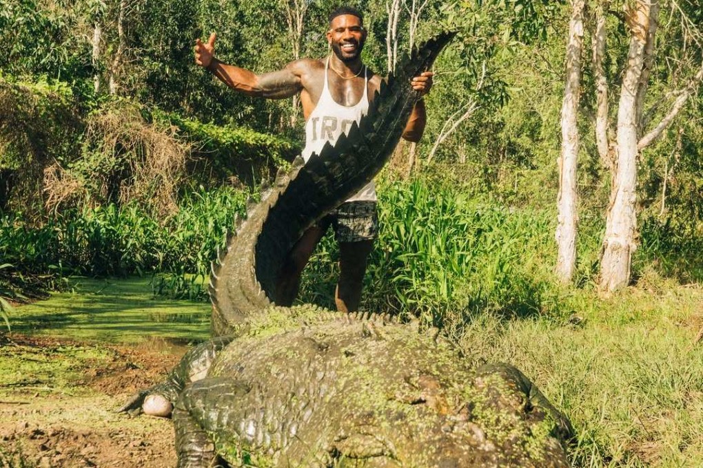 US influencer Mike Holston poses with a crocodile in Australia. Photo: Instagram/therealtarzann