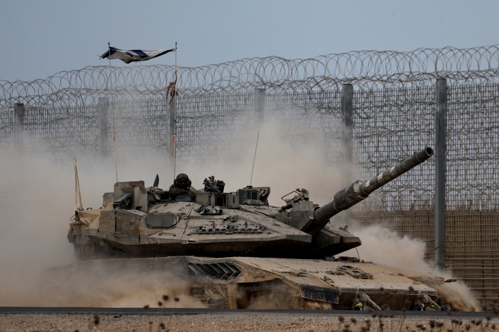 An Israeli tank manoeuvres on the Israeli side of the border with Gaza on Thursday. Photo: Reuters