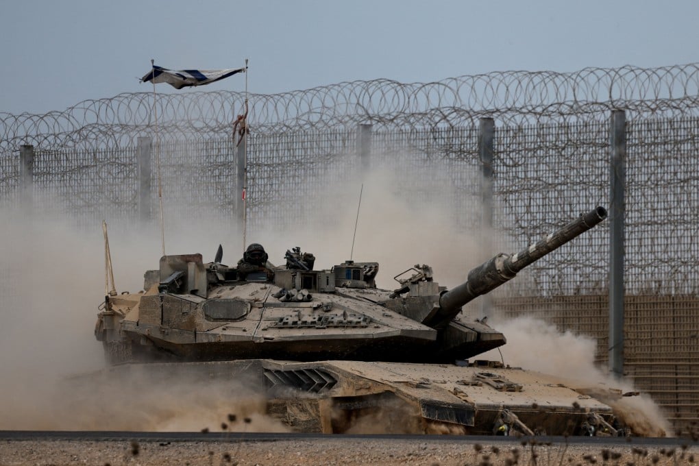 An Israeli tank manoeuvres on the Israeli side of the border with Gaza on Thursday. Photo: Reuters